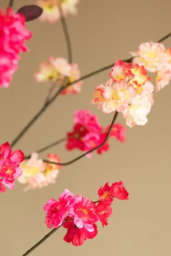 Close up of Jula Bloom’s Rosa silk flower bouquet with peach and pink blooms