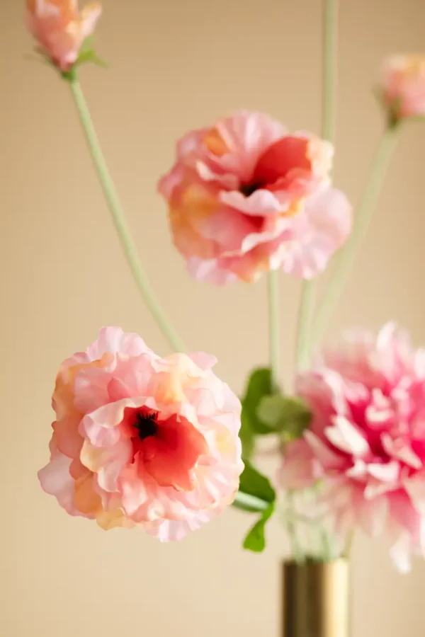 Close up of Jula Bloom’s Jacinda silk flower bouquet with peach and pink blooms