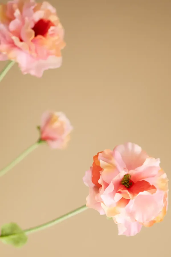 Close up of Jula Bloom’s Jacinda silk flower bouquet with peach and pink blooms