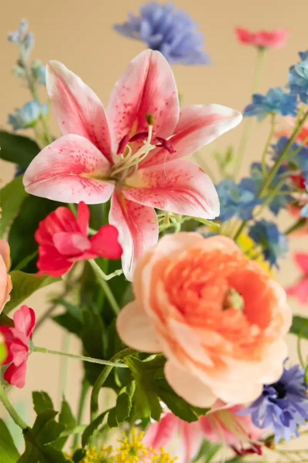 Close up of Jula Bloom’s Lovelace silk flower bouquet with multi-colored blooms