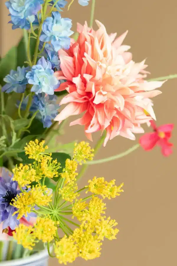 Close up of Jula Bloom’s Lovelace silk flower bouquet with multi-colored blooms