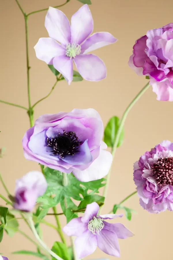 Close up of Jula Bloom’s Juliana silk flower bouquet with purple and mauve blooms