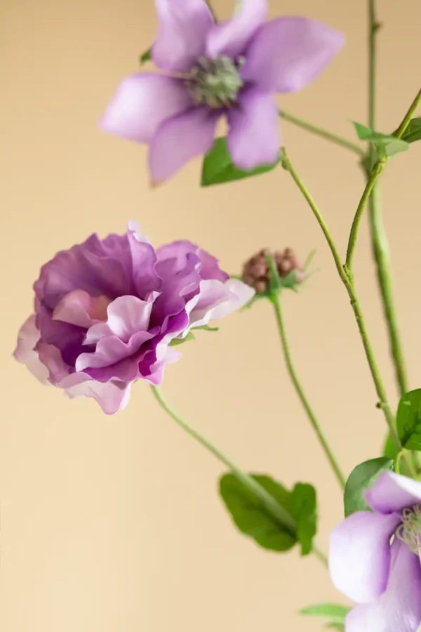 Close up of Jula Bloom’s Juliana silk flower bouquet with purple and mauve blooms