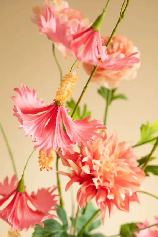 Close up of Jula Bloom’s Coco silk flower bouquet with pink and peach blooms