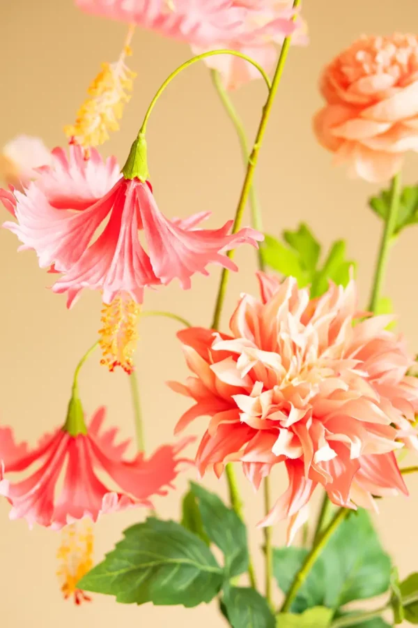 Close up of Jula Bloom’s Coco silk flower bouquet with pink and peach blooms