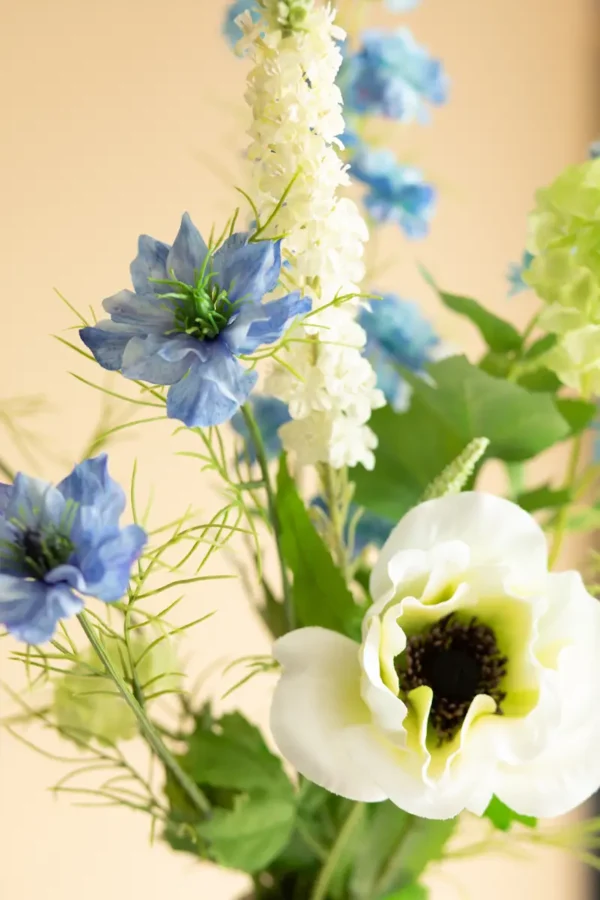 Close up of Jula Bloom’s Greta silk flower bouquet with white and blue blooms