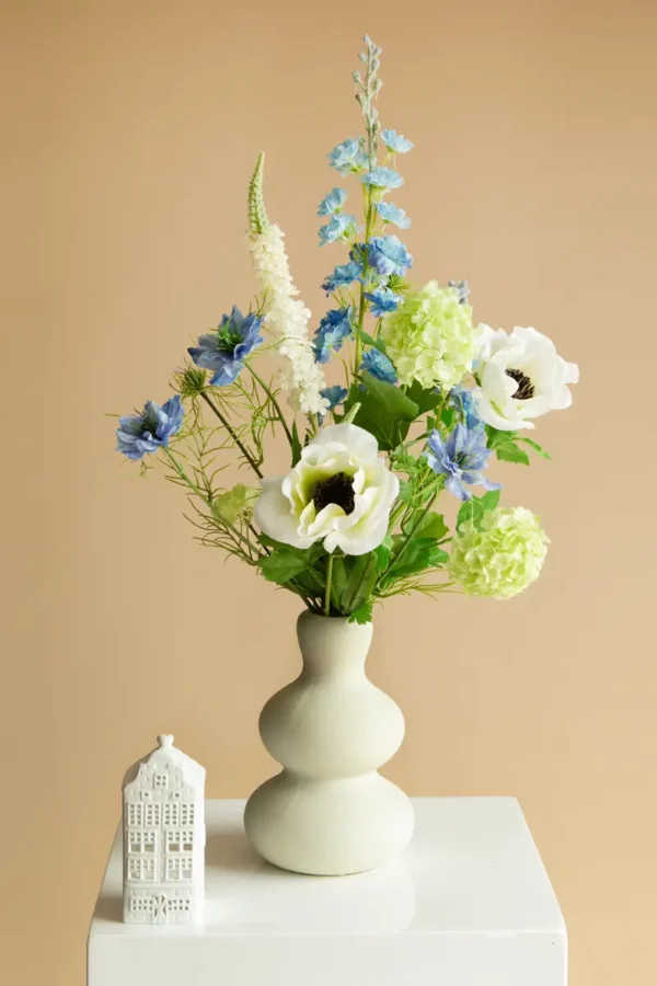 Jula Bloom’s Greta silk flower bouquet with white and blue blooms, in a white ceramic vase