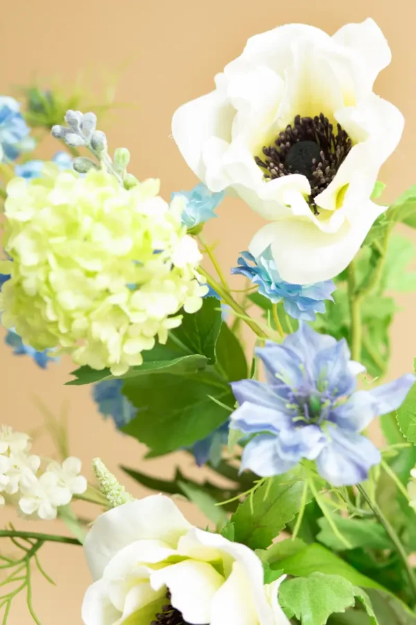 Close up of Jula Bloom’s Greta silk flower bouquet with white and blue blooms