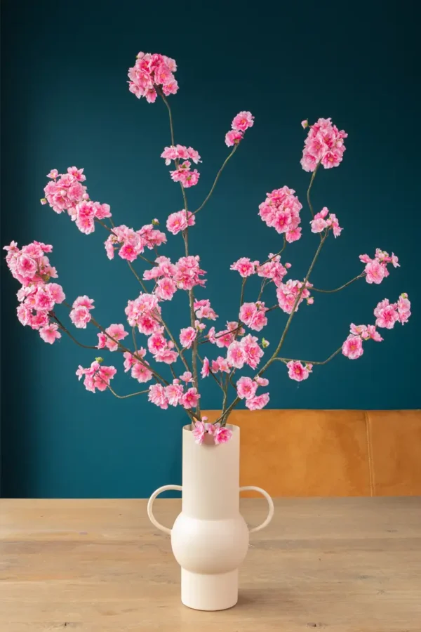 Jula Bloom’s Yosano silk flower bouquet with pink blooms, in a white vase with two handles