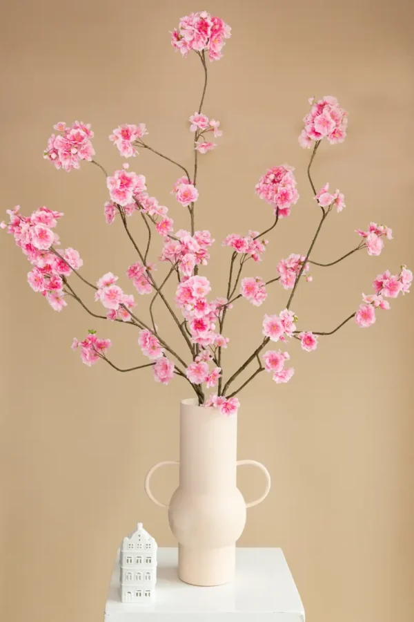 Jula Bloom’s Yosano silk flower bouquet with pink blooms, in a white vase with two handles