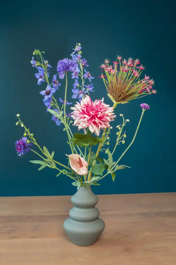 Jula Bloom’s Robinson silk flower bouquet with purple and pink blooms, in a grey vase