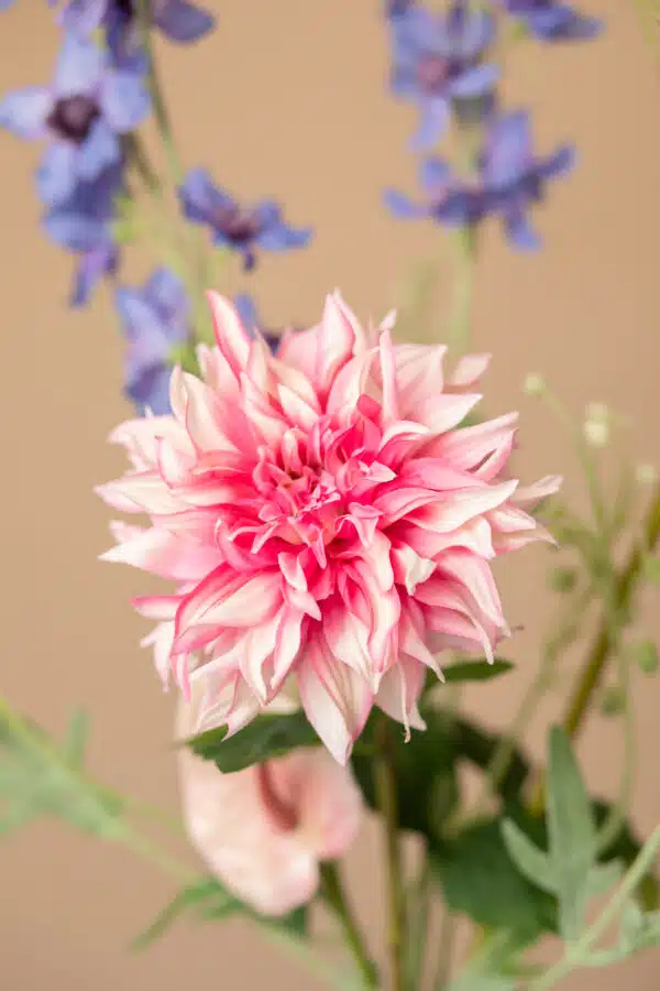 Close up of Jula Bloom’s Robinson silk flower bouquet with purple and pink blooms