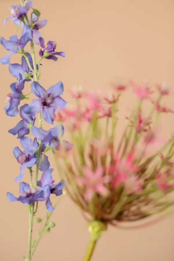 Close up of Jula Bloom’s Robinson silk flower bouquet with purple and pink blooms