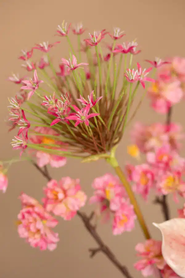 Close up of Jula Bloom’s Jacobs silk flower bouquet with pink and red blooms