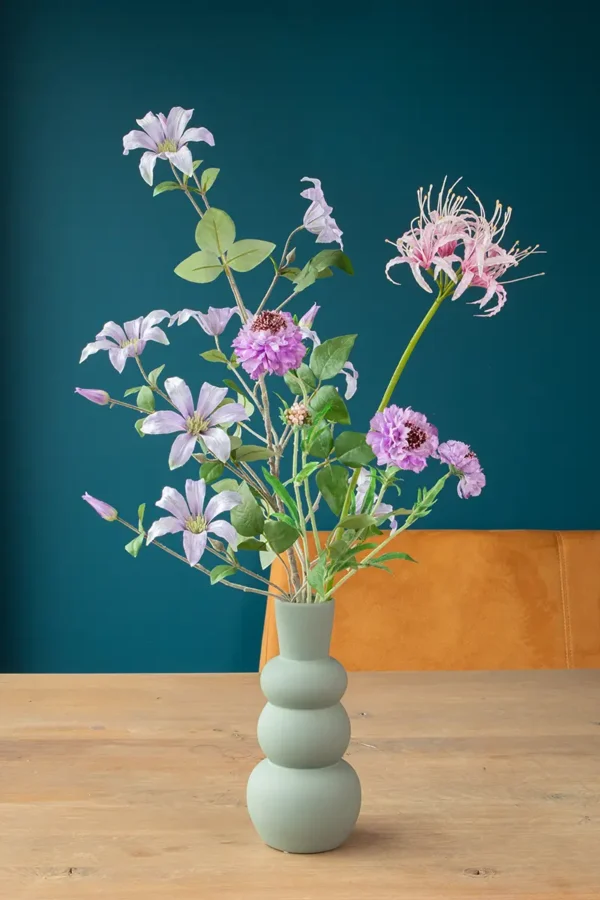 Jula Bloom’s Roosevelt silk flower bouquet with purple and pink blooms, in a grey vase