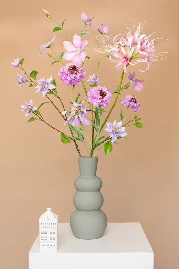 Jula Bloom’s Roosevelt silk flower bouquet with purple and pink blooms, in a grey vase