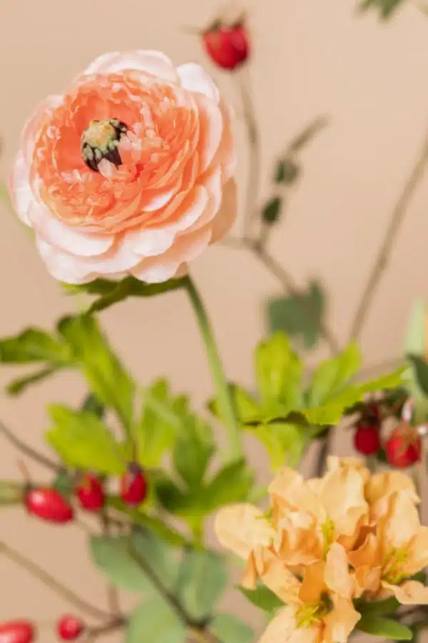 Jula Bloom’s Malala silk flower bouquet with pink and orange blooms, red buds and green leaf