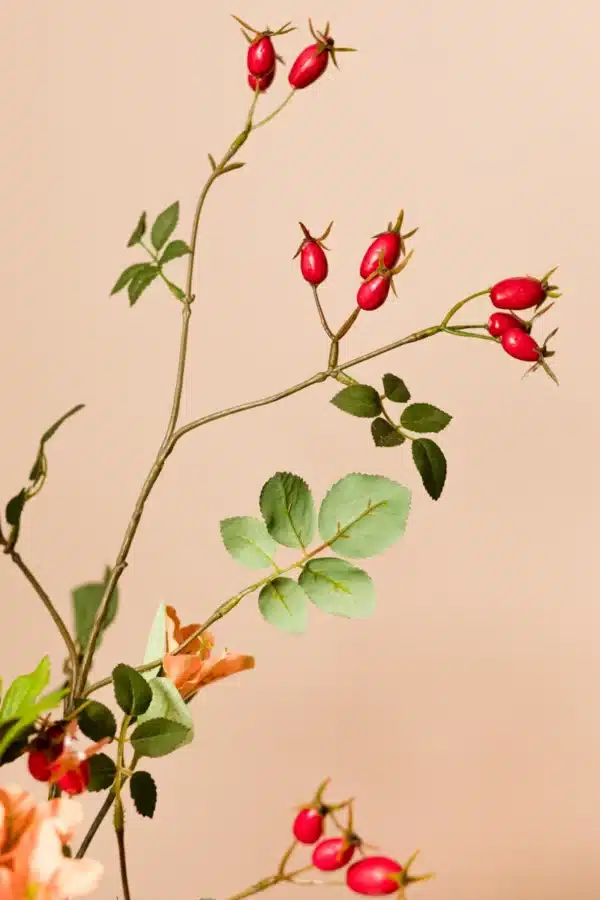 Jula Bloom’s Malala silk flower bouquet with pink and orange blooms, red buds and green leaf