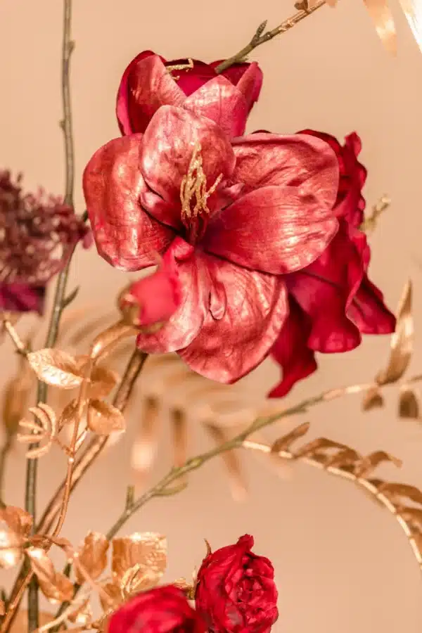 Jula Bloom’s Angelou silk flower bouquet with deep red blooms and gold leaf