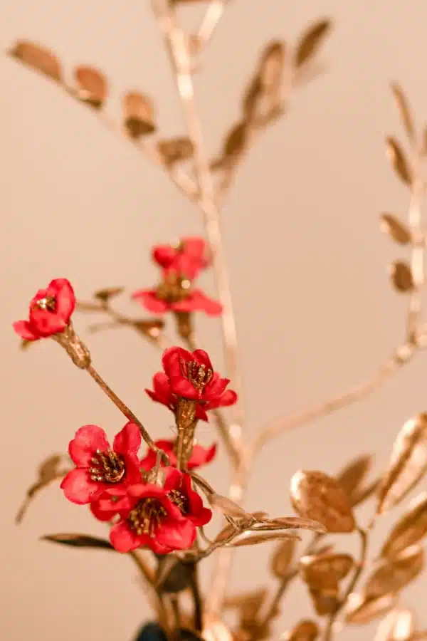 Jula Bloom’s Franklin silk flower bouquet with red blooms and gold leaf