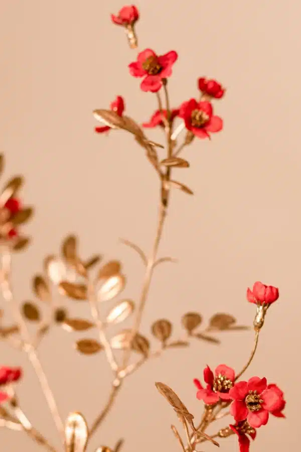 Jula Bloom’s Franklin silk flower bouquet with red blooms and gold leaf